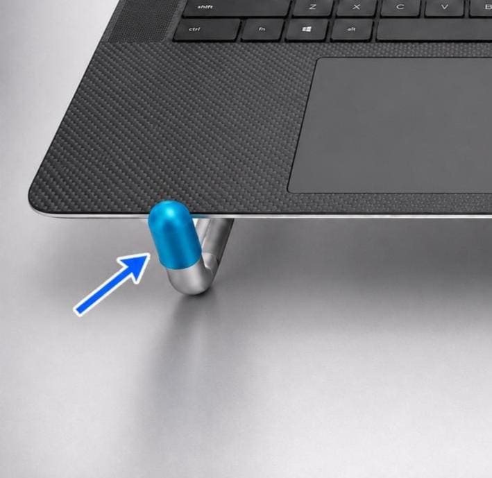 Small blue flexible end cap fitted to the metal leg of a laptop stand